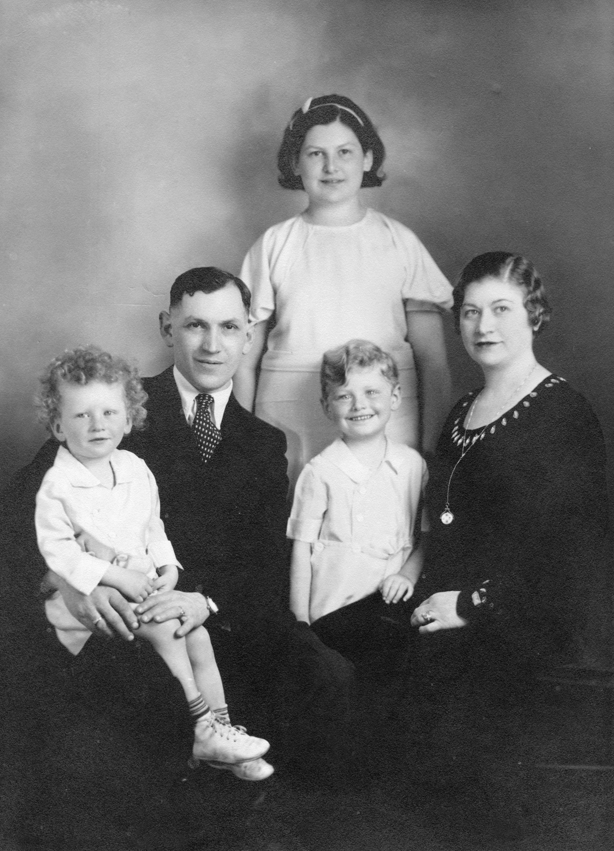 Albert and Esther Fox with Leona, Roland, and Charlie. Studio portrait, family collection.