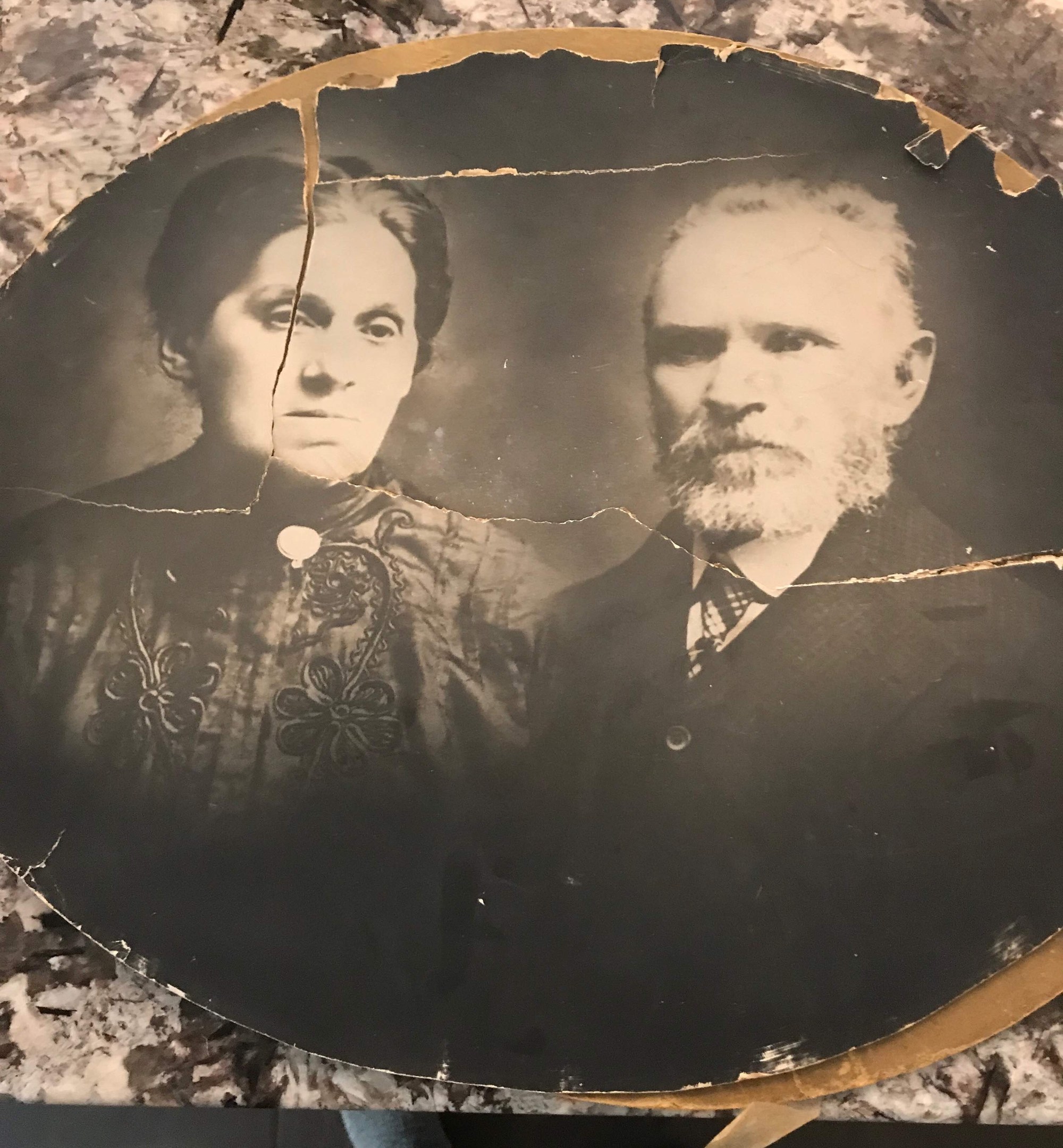 Oval cabinet portrait of Reva Heft and Meyer Fox, cracked and torn with age, photographed as it survives today